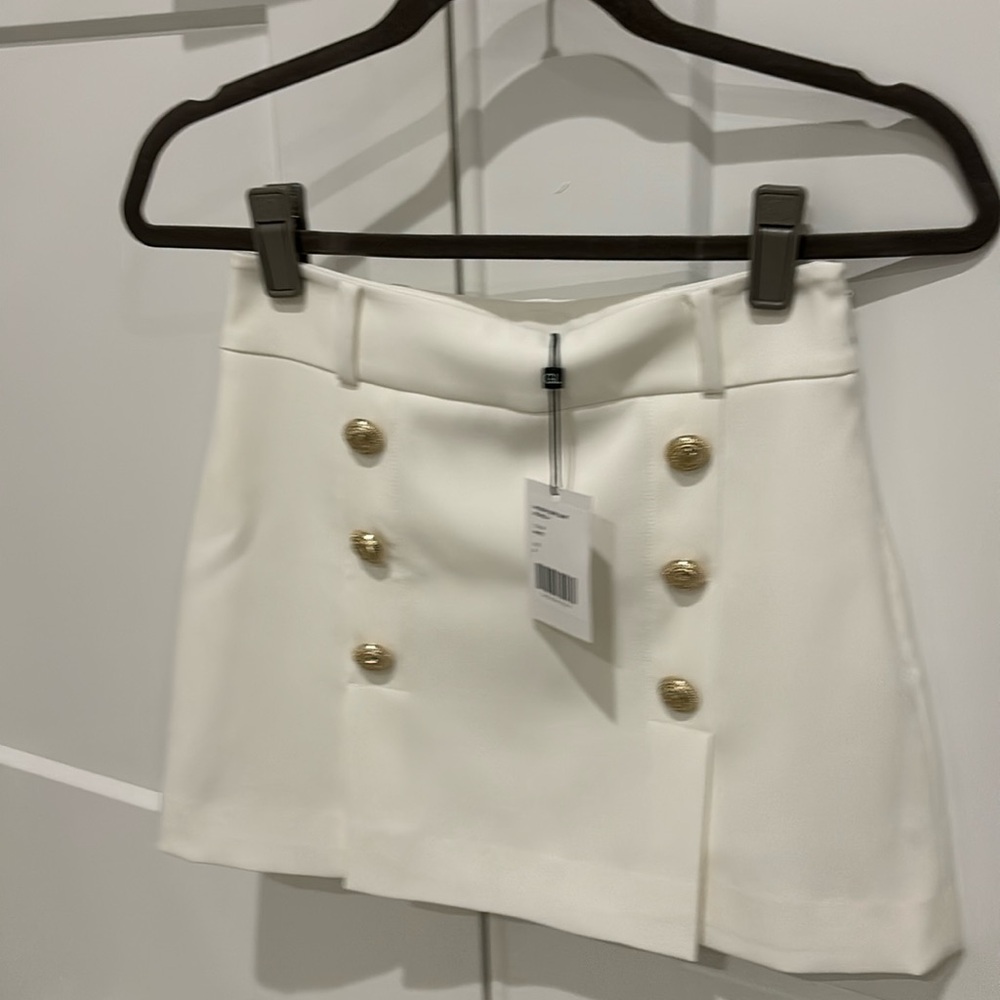 Woman’s white mini skirt